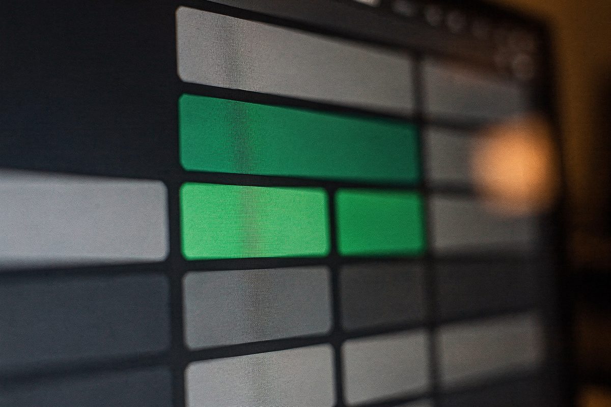 A macro close-up of a lit soundboard grid interface on a screen